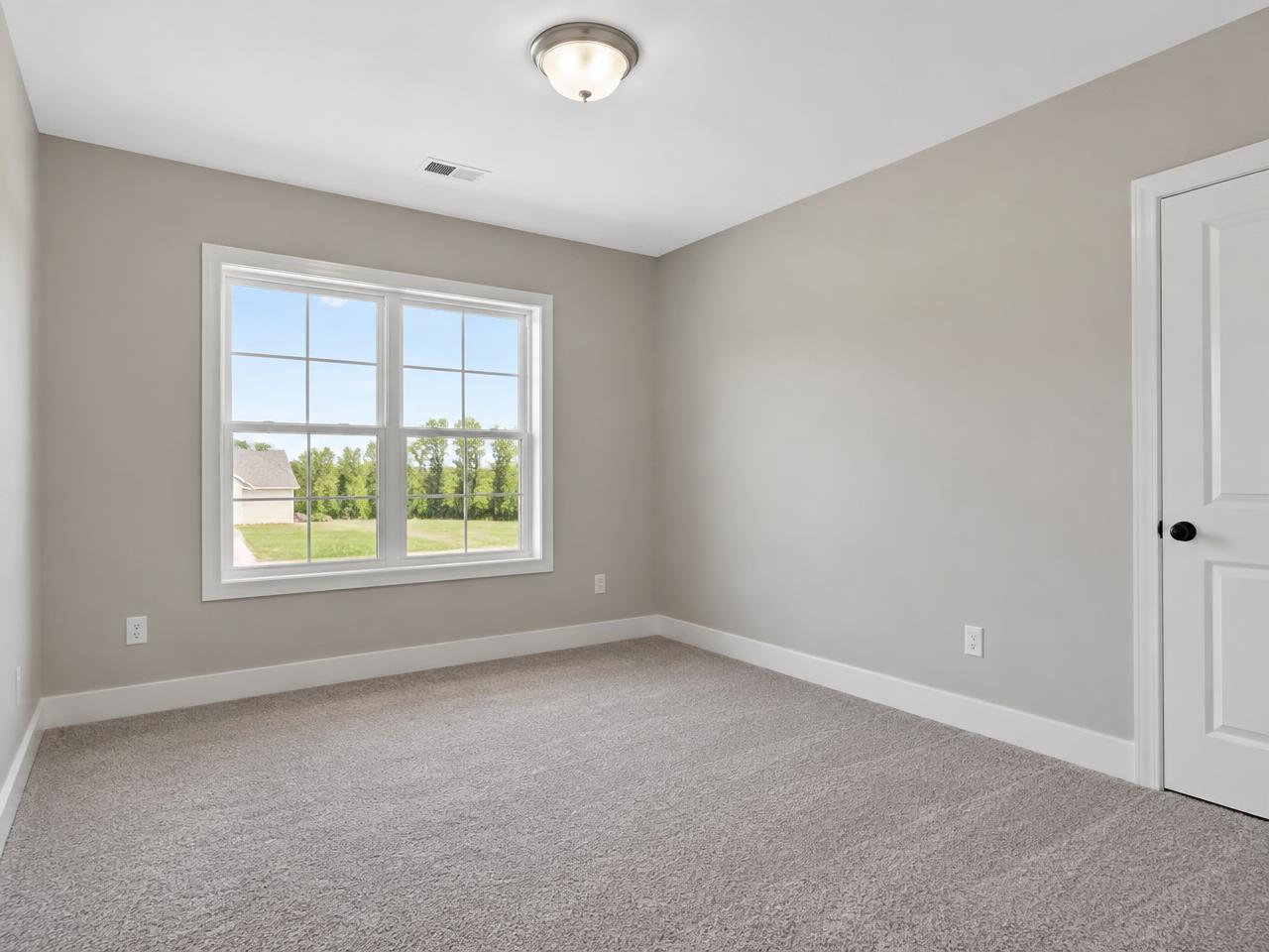 Freshly painted bedroom with greige walls prepared for resale