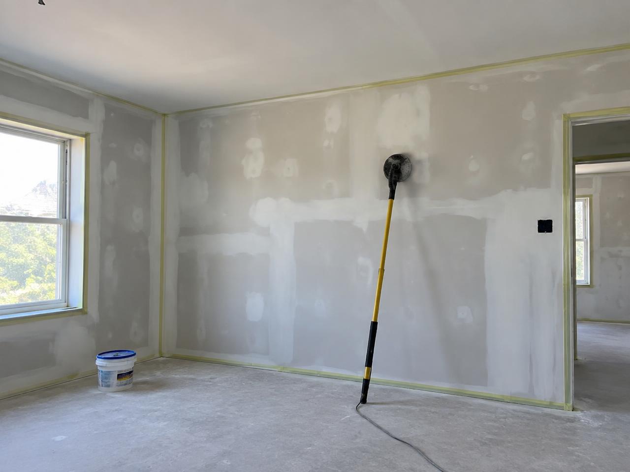 Interior walls patched with joint compound and sanded before painting